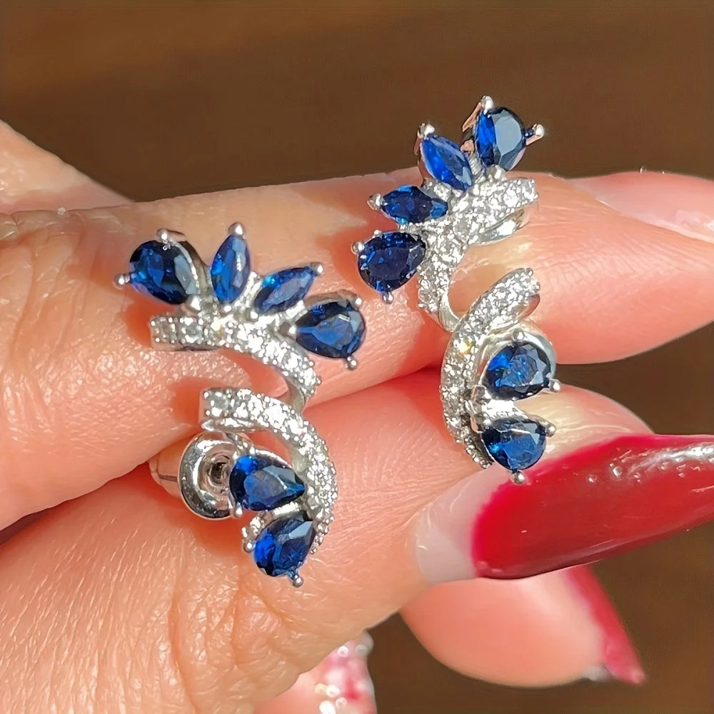 A pair of blue threaded zircon earrings and a white zircon bracelet. Suitable for women to wear. A cute and shiny combination.