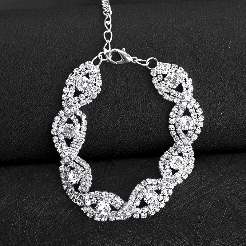 A pair of blue threaded zircon earrings and a white zircon bracelet. Suitable for women to wear. A cute and shiny combination.